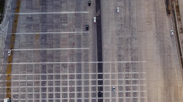 Multi-lane Concrete Highway Toll Plaza Approach With Daytime Traffic. aerial topdown shot