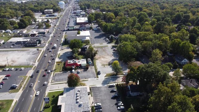 Drone footage of the historic Route 66 corridor near Rail Haven Motel in Springfield, Missouri, featuring traffic, businesses, and urban development.
