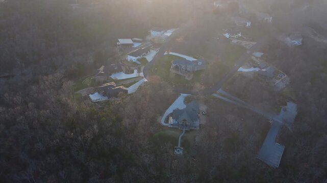 Drone footage of luxury waterfront homes overlooking Table Rock Lake near Branson West, Missouri, featuring scenic shoreline views and Ozark hills.