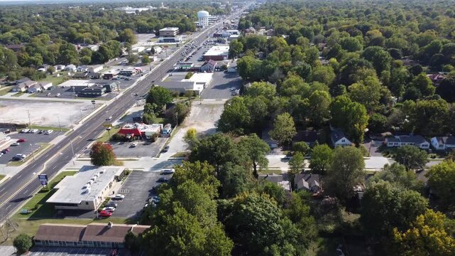 Drone footage of Historic Route 66 in Springfield, Missouri, featuring commercial businesses, neighborhoods, traffic, and a prominent water tower.