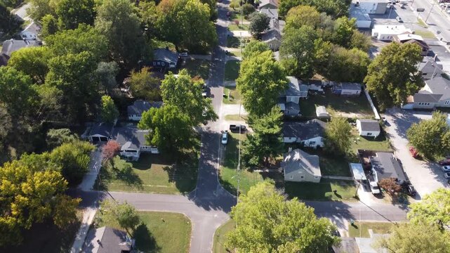 Drone footage of a residential neighborhood near the Rail Haven area in Springfield, Missouri, featuring tree-lined streets, homes, and urban greenery.