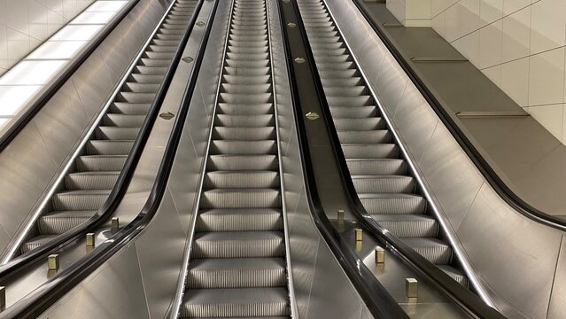 modern escalators in contemporary shopping mall or metro station interior