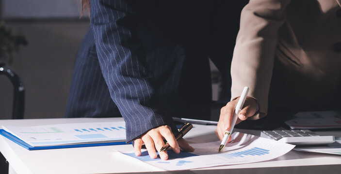 Accountants processing financial documents and taxes, managing corporate finance in a modern office. Audit and taxes in business