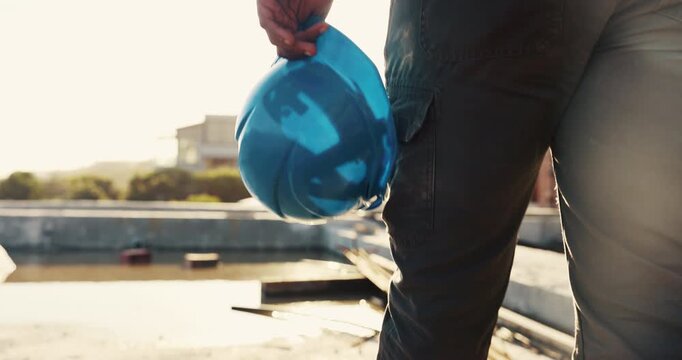 Hands, architect and walking with helmet on construction site for building safety, PPE or security. Person, contractor or civil engineer with hard hat or gear for architecture rules or regulations