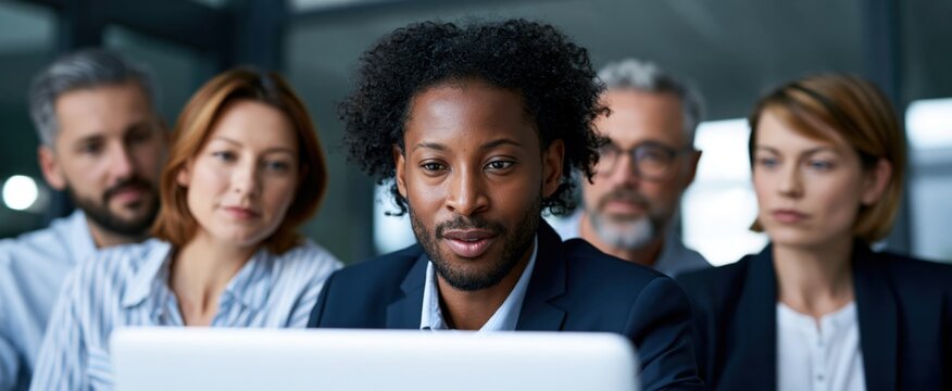 A dynamic corporate team analyzes financial data on enterprise ERP software in a vibrant office.