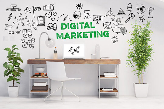 Schreibtisch mit gr&uuml;nem Schriftzug &bdquo;Digital Marketing&ldquo; &uuml;ber Arbeitsplatz, umgeben von Icons
