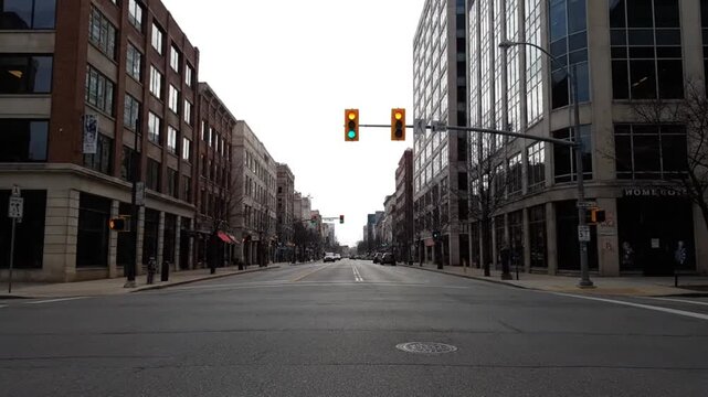 Empty City Street with Traffic Lights and Buildings.