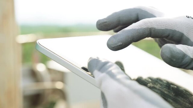 Close up hand engineer use digital tablet management air pollution reduction, continuous emission monitoring system factory and industry manufacturing. Clean air Eco friendly. Environment sustainable	