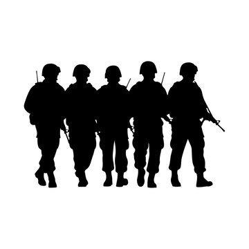 Silhouette of Five Soldiers Standing Together in Formation.