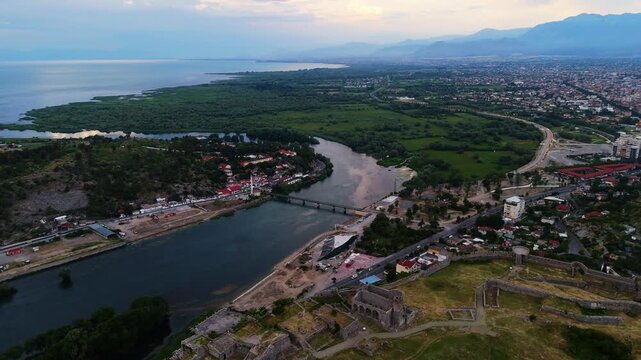Aerial sunset  Shkod&euml;r, Albania. Historical fortress panorama with Drin and Buna rivers, bridge, and scenic Balkan landscape