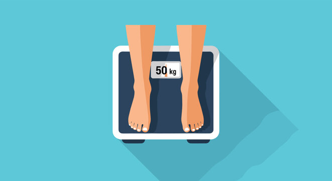 Overhead view of a person standing on a black and white digital weighing scale showing a weight of fifty kilograms.