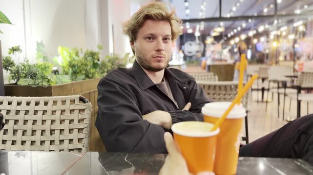 Lifestyle portrait of young man using a smartphone outdoors