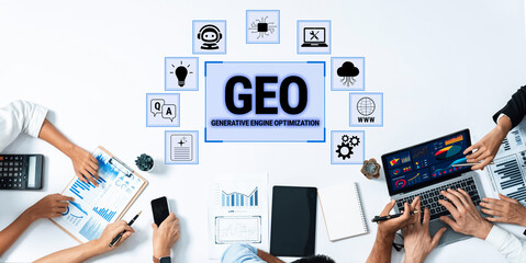 Obraz premium Hands on a Desk with Technology Elements Representing Generative Engine Optimization, Data Analysis, and Digital Innovation Fluxor.