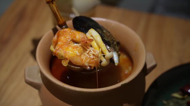 Hot and Spicy Tom-Yum Goong soup with shrimp River prawn and mushrooms, spicy soup traditional Thai food