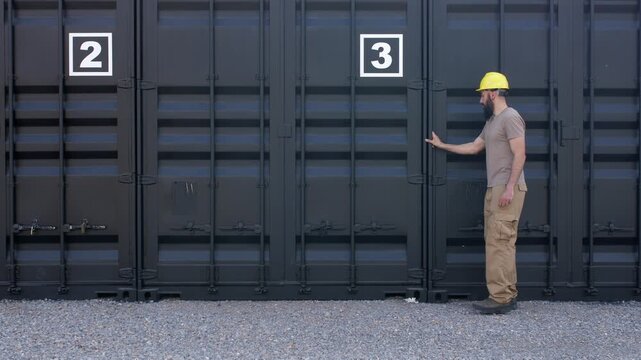 Warehouse worker inspecting shipping containers for logistics