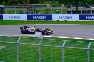 Naklejka premium May 24, 2025, Montreal, Canada: Red Bull Racing Formula 1 car during by Hadjar or Verstappen, demonstration run at Circuit Gilles Villeneuve. g.