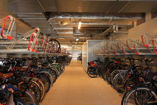 two rows of Two-tier bike rack in a parking building with stacks