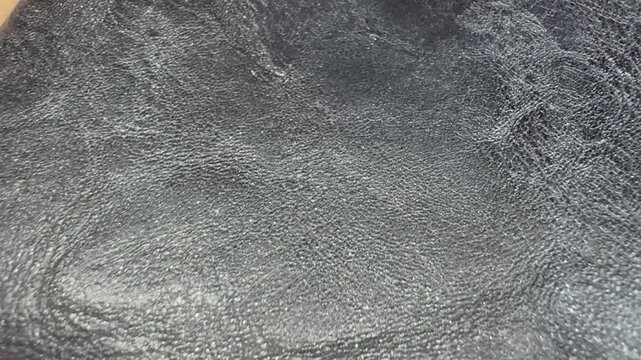 Macro Close Up of Shimmering Leather Texture Background. Close Up Glitter Leather Texture Background with Shimmering Surface
Macro view of glitter leather texture with a subtle shimmering surface. 