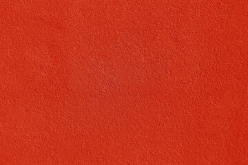 Fototapeta premium Textured background. Decorative in plaster wall, external of facade. Texture of red scarlet pink stucco plaster wall of clay house structure concrete background. Brown clay mud cement texture pattern