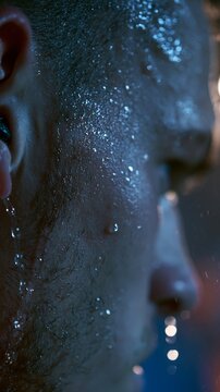 Macro view of a footballers damp earlobe glistening under stadium lights sweat running behind it while the background noise resonates in the players concentrated gaze.