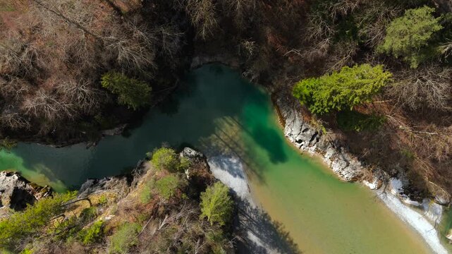 Fuessen, Germany. Beautiful aerial view of Lechfall waterfall in Upper Bavaria during spring. Drone panorama of the turquoise Lech river canyon surrounded by wild alpine forest rocks.