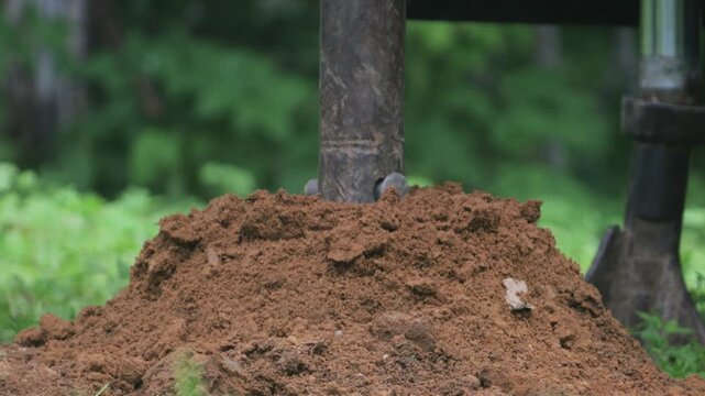 engineering geological surveys, environmental soil analysis, a drill drills into the soil