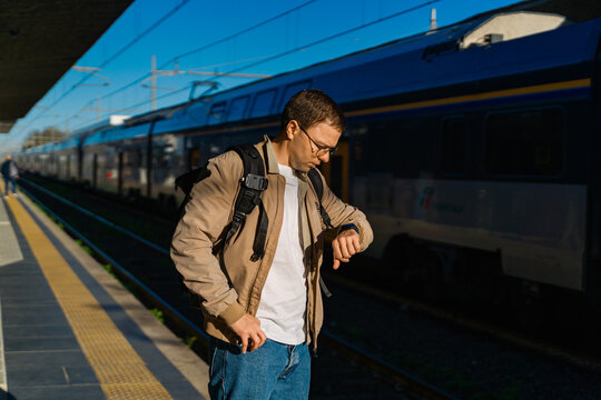 Traveler Checking Watch Near Train