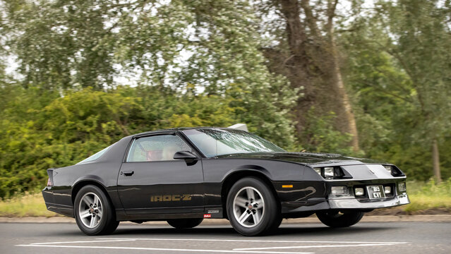 Stony Stratford,Bucks,UK - June 7th 2026: 1987 black Chevrolet Camaro classic American car driving on a British road