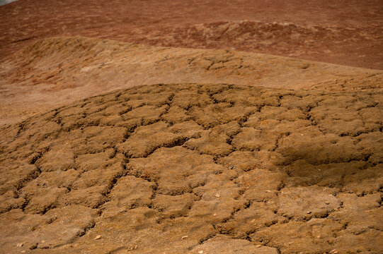 Cracked dry ground texture in arid landscape &ndash; drought concept. Texture Nature 