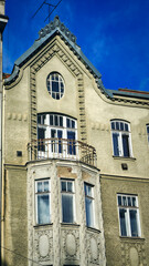Detailed View of Historic Architectural Oriel Window Under Balcony © Markiian Pankiv