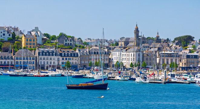 Scenic harbor of Le Croisic town in Brittany, France with traditional buildings and boats