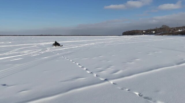  Trying to keep up with a speeding snowmobile. Drone view.