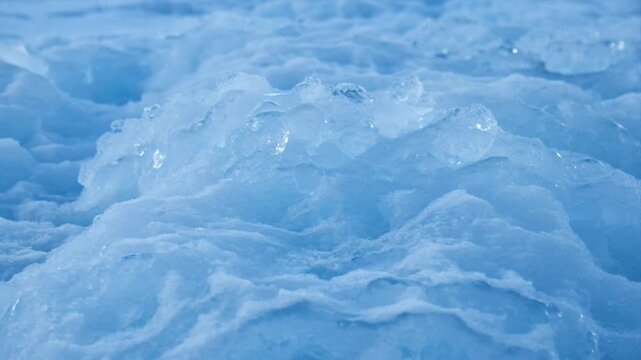 Blue ice glacier frozen texture nature unseen cold abstract winter crystal surface pattern outdoor purity serene arctic landscape rough ice closeup soft blue tone frozen nature detail evokes quiet