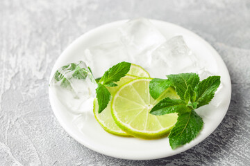 Alcohol cocktail mojito with lime and mint in copper glasses with ice. Summer refreshing drink © murziknata