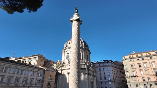 Cinematic View Of The Ancient Trajan Column With Church In The Background