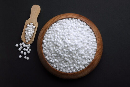 Indian food called Sabudana whole or Tapioca Sago Pearls, Saboodana in wooden bowl isolated on black background 