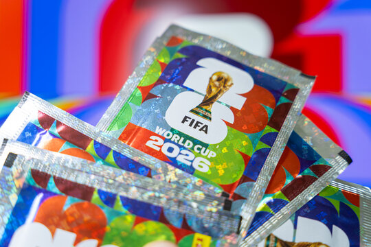 Official FIFA World Cup 2026 merchandise packs with holographic foil design and tournament trophy branding, close up of soccer football championship collectibles