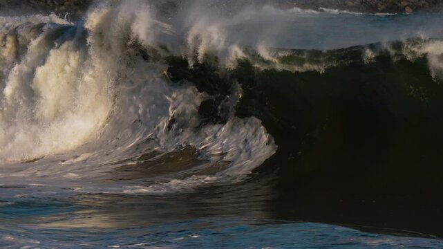 Giant shorebreak wave breaking at The Wedge, Newport beach California