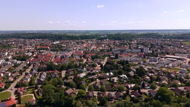 Aerial drone video of Illertissen in Swabia, Bavaria, Germany. Establishing panoramic shot overlooking the historic small town located in the scenic Iller valley district of Neu-Ulm.