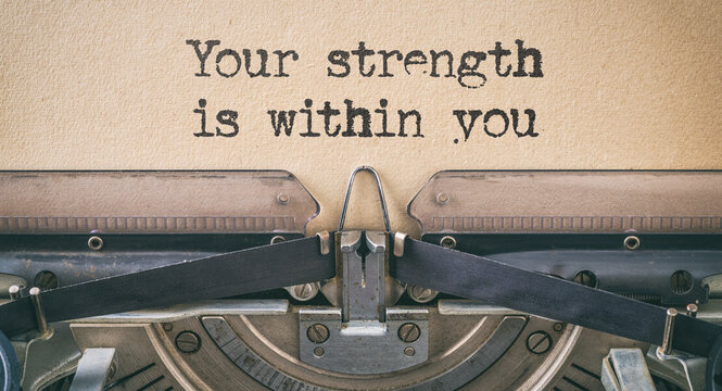 Text written with a vintage typewriter - Your strength is within you