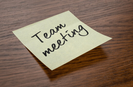 Sticky note with the text Team meeting