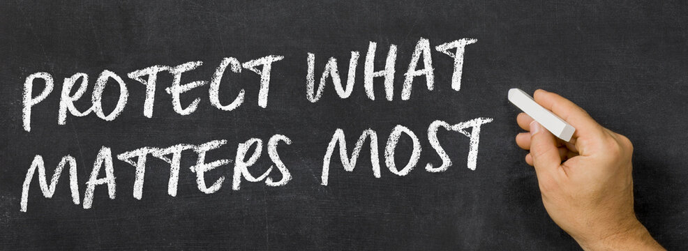 Text written on a blackboard - Protect What Matters Most