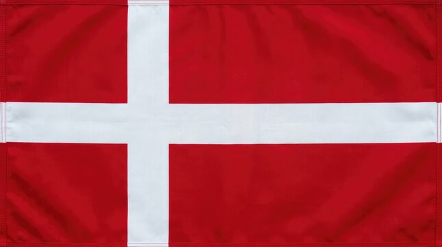 Red Danish Flag with White Nordic Cross Displayed on Fabric Background