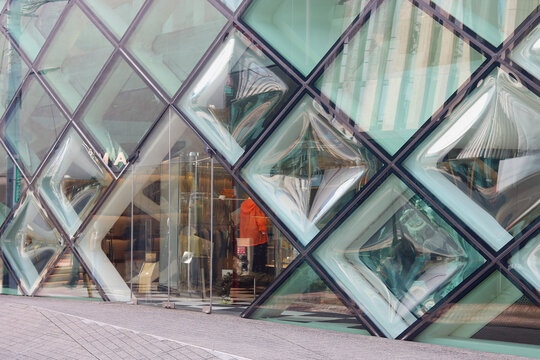 TOKYO, JAPAN - April 5, 2025: Detail of the Prada store in Tokyo's Aoyama area. It was designed by Herzog and de Meuron.