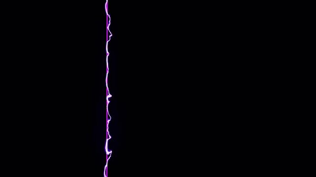 Abstract purple energy light bolt flashing on black background.