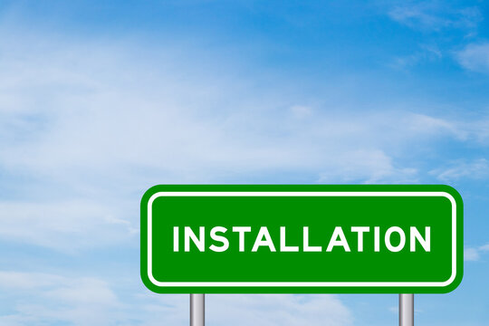 Green color transportation sign with word installation on blue sky with white cloud background