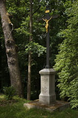Obraz premium Wayside cross on the dam of pond Rozmberk,South Bohemian,Czech Republic,Europe,Central Europe 