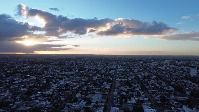 aerial drone view of mar del plata coastline and city traffic, cinematic aerial drone footage of mar del plata, argentina. ocean coastline, city buildings, residential neighborhoods and moving traffic