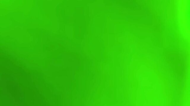 Light leak transition with vibrant green and soft white hues, fading into blackness. This video is ideal for overlaying on footage to create dynamic visual effects.