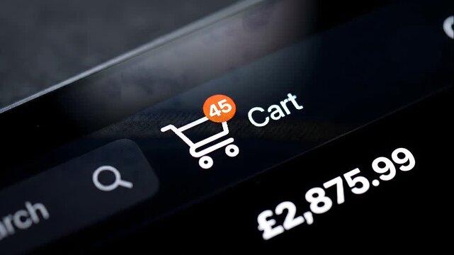 Close-Up of Online Shopping Cart Icon with Notification Badge on Dark Screen